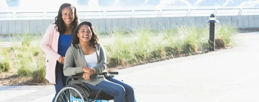 Nurse taking care of patient on wheelchair