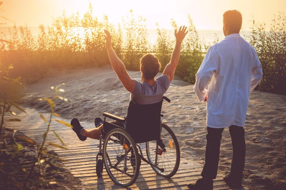 Doctor helping man on wheelchair